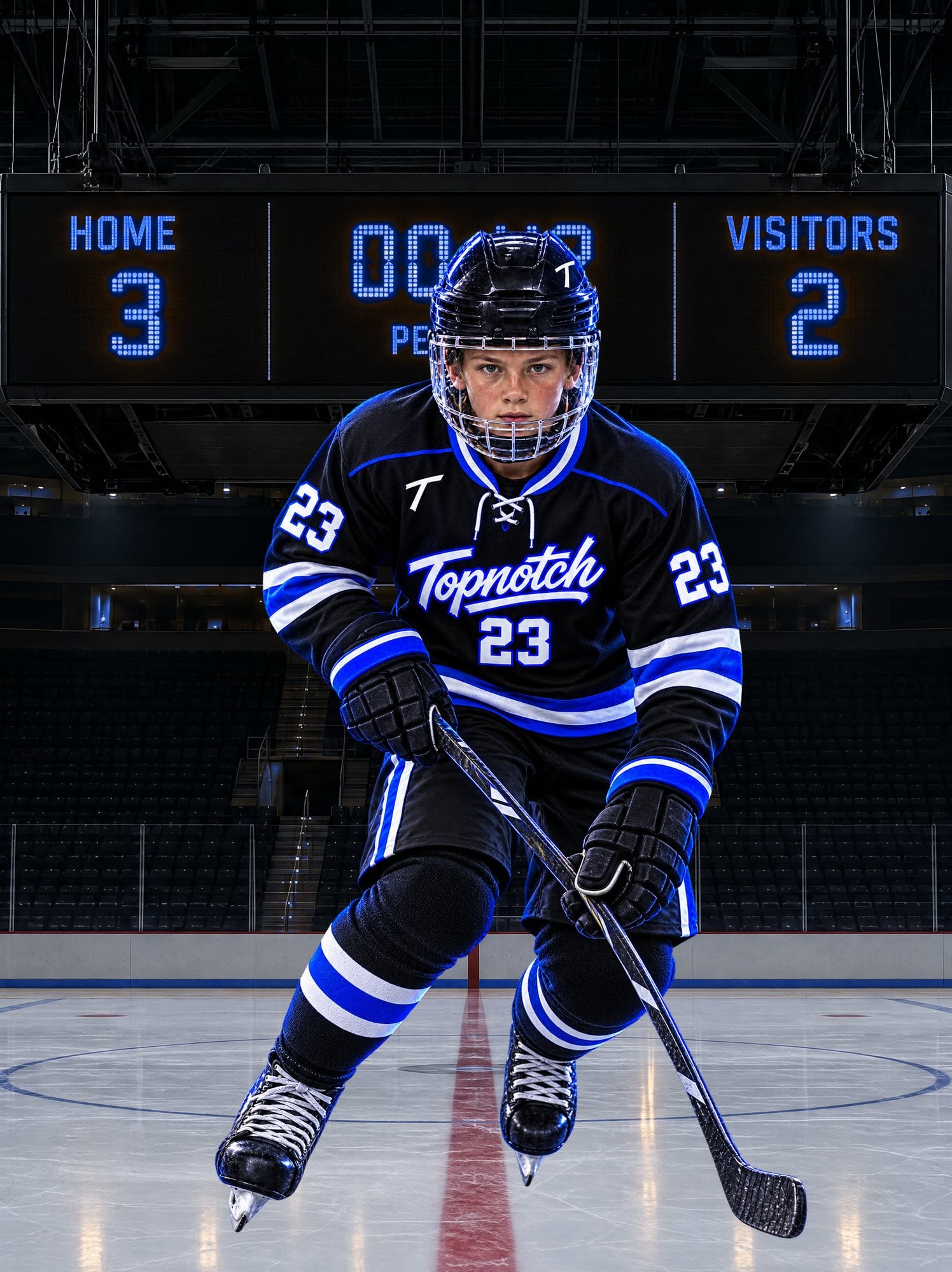 Hockey player in a black, white and electric-blue Topnotch number 23 kit skating beneath a blue LED scoreboard